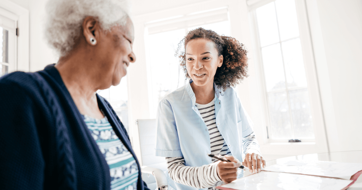 Working for an agency, like this caregiver who’s with a client, can be a choice that leads to a good job.