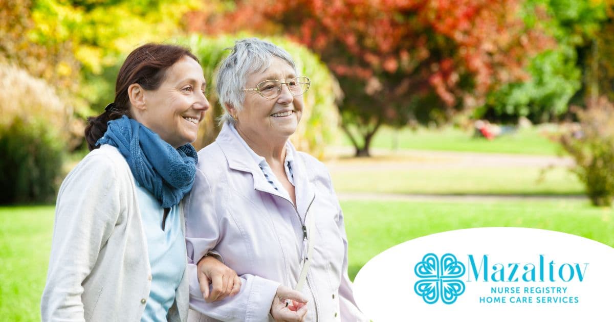 A recently retired woman enjoys her caregiving job as she walks with a senior client outside.