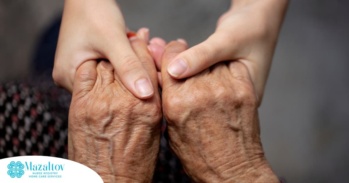 Younger hands hold older ones, representing the care and compassion of caregiving and how caregivers can help, even in ways like implementing stroke prevention strategies.